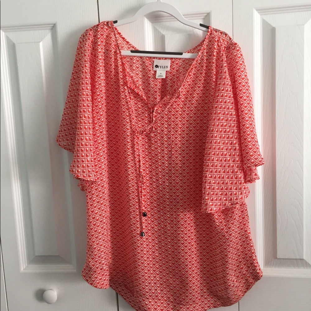Orange and white flared sleeve blouse.